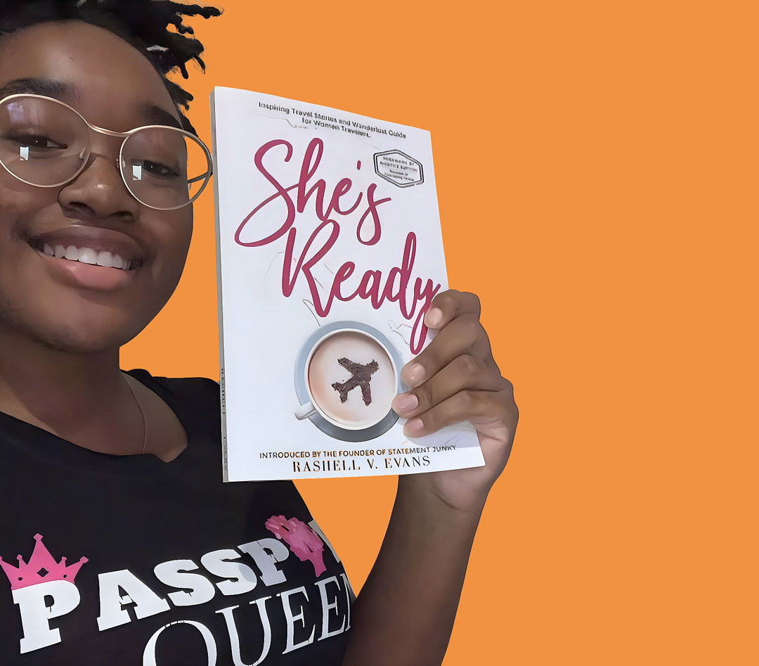 Photo of a fellowship student holding the book 'She's ready' by Rashell Evans